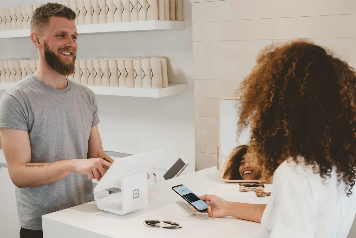 Illustrative stock photograph of a customer speaking with a shop assistant
