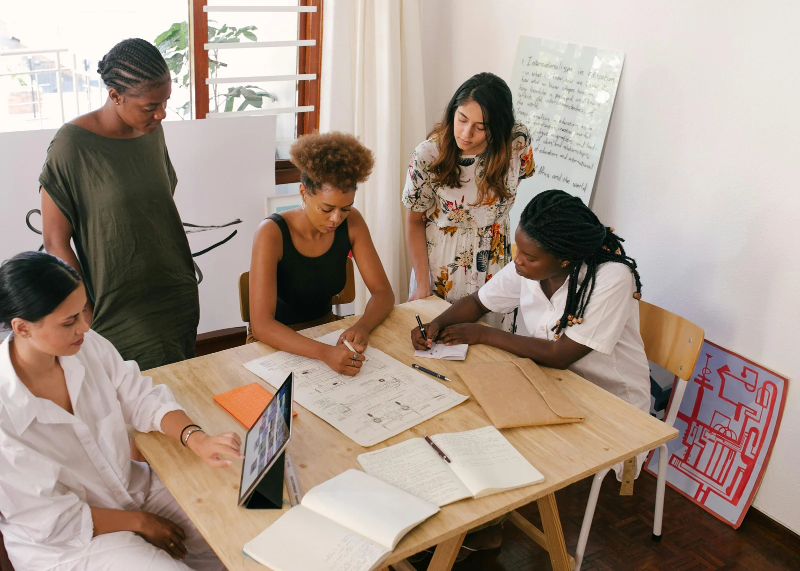 Illustrative photograph of a team planning around a shared table